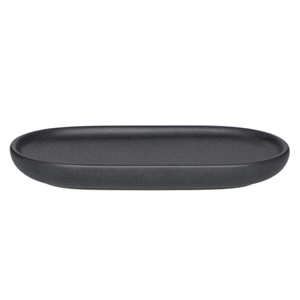 Granite saippua-alunen. Tummanhamaa. Muodoltaan suorakaide pyöristeltyillä reunoilla.